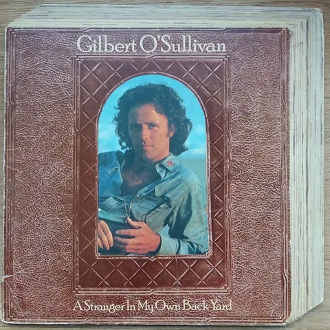 Обложка альбома «A Stranger In My Own Back Yard» — исполнитель GILBERT O'SULLIVAN