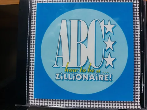 Обложка альбома «How To Be A Zillionaire!» — исполнитель ABC